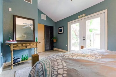 Bedroom with large double doors leading to the outside