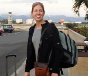 The author wearing a backpack standing outside Hickam AFB passenger terminal