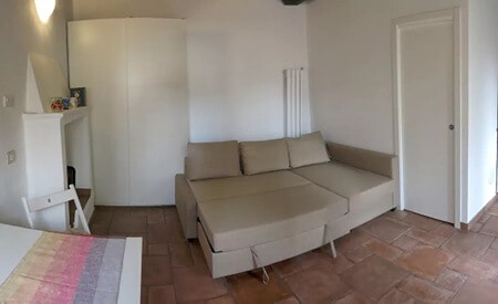 Pullout sofa in our AirBnb apartment in Milan, Italy