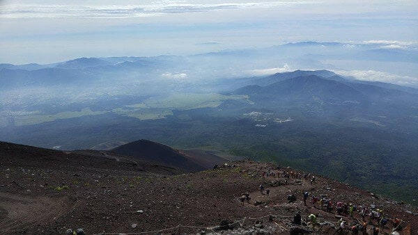 View of the mountains with many hikers climbing Mount Fuji