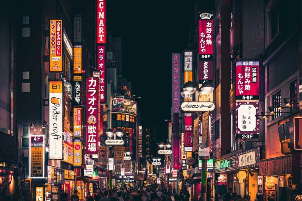 the bright lights of downtown tokyo at night