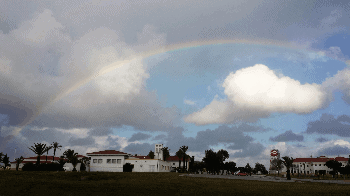 A rainbow stretched over the white buildings of Rota Naval Base