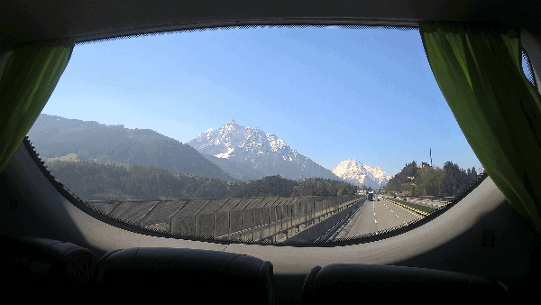 Picture of snow-capped mountains as seen out the window of the Medevac bus