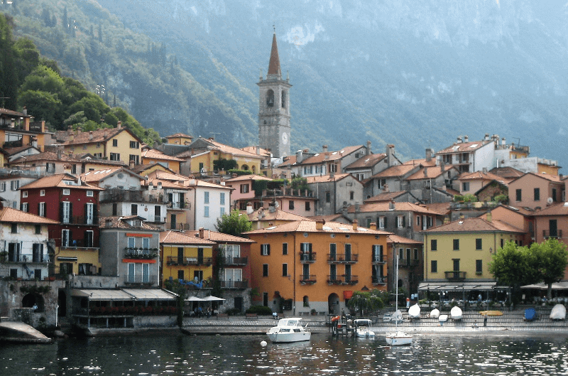 A colorful lakeside town surrounded by mountains