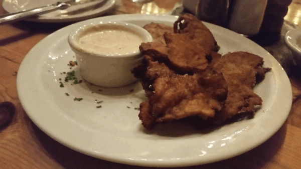 Rocky Mountain Oysters next to a white dipping sauce