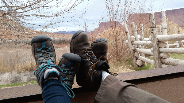 Picture of the writer's and her husband's hiking boots as they relax on their hotel patio