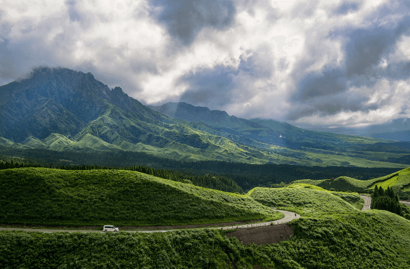 Rent a car in Japan to see the beautiful, green Mt. Aso region.