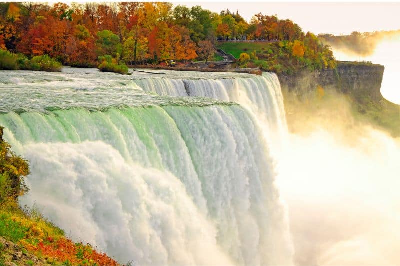 Huge waterfalls surrounded by trees in autumn