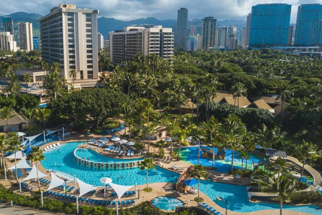 The giant pool surrounded by tropical greenery at the Hale Koa Hotel, an Armed Forces Recreation Center