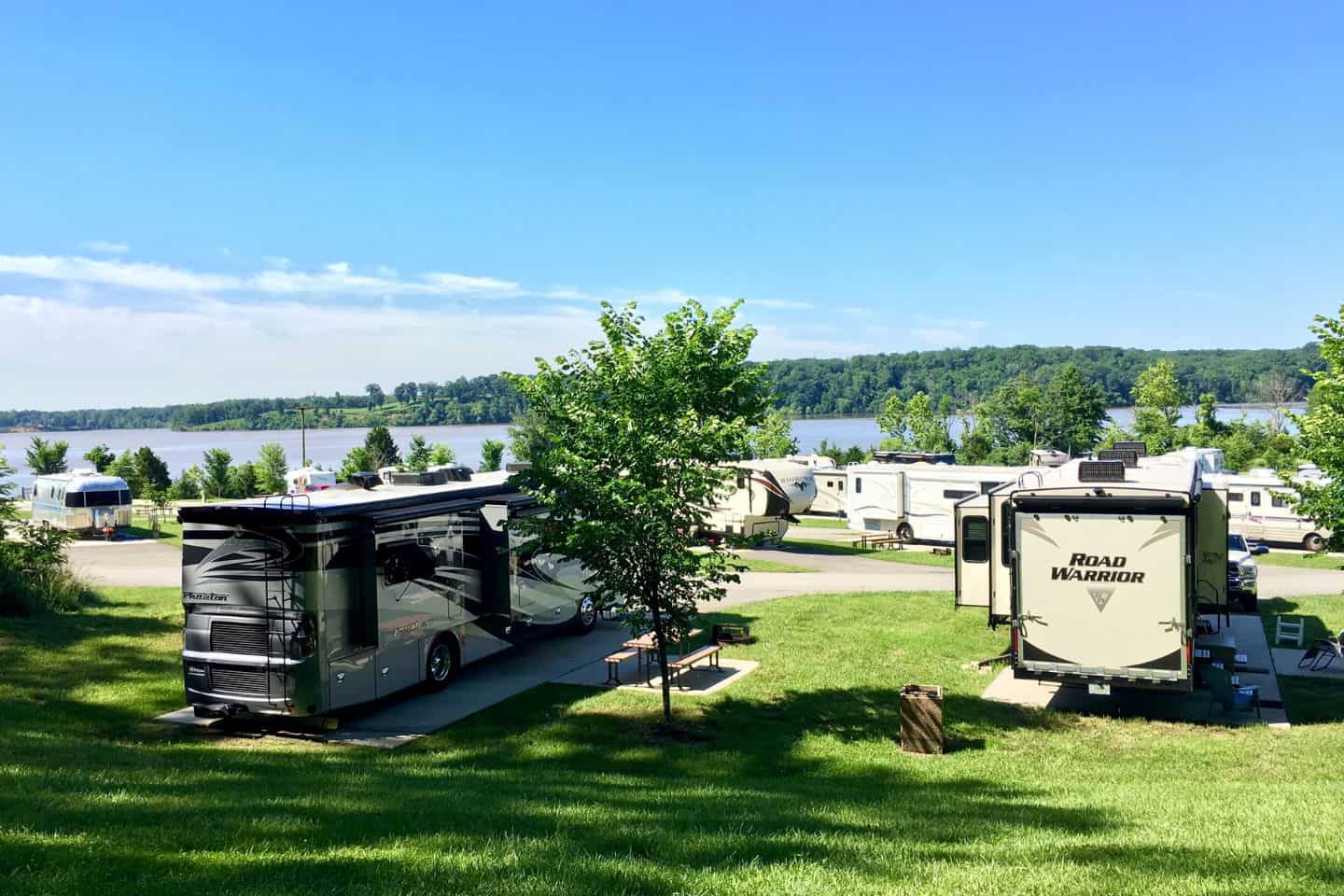 An RV park and campground next to a lake