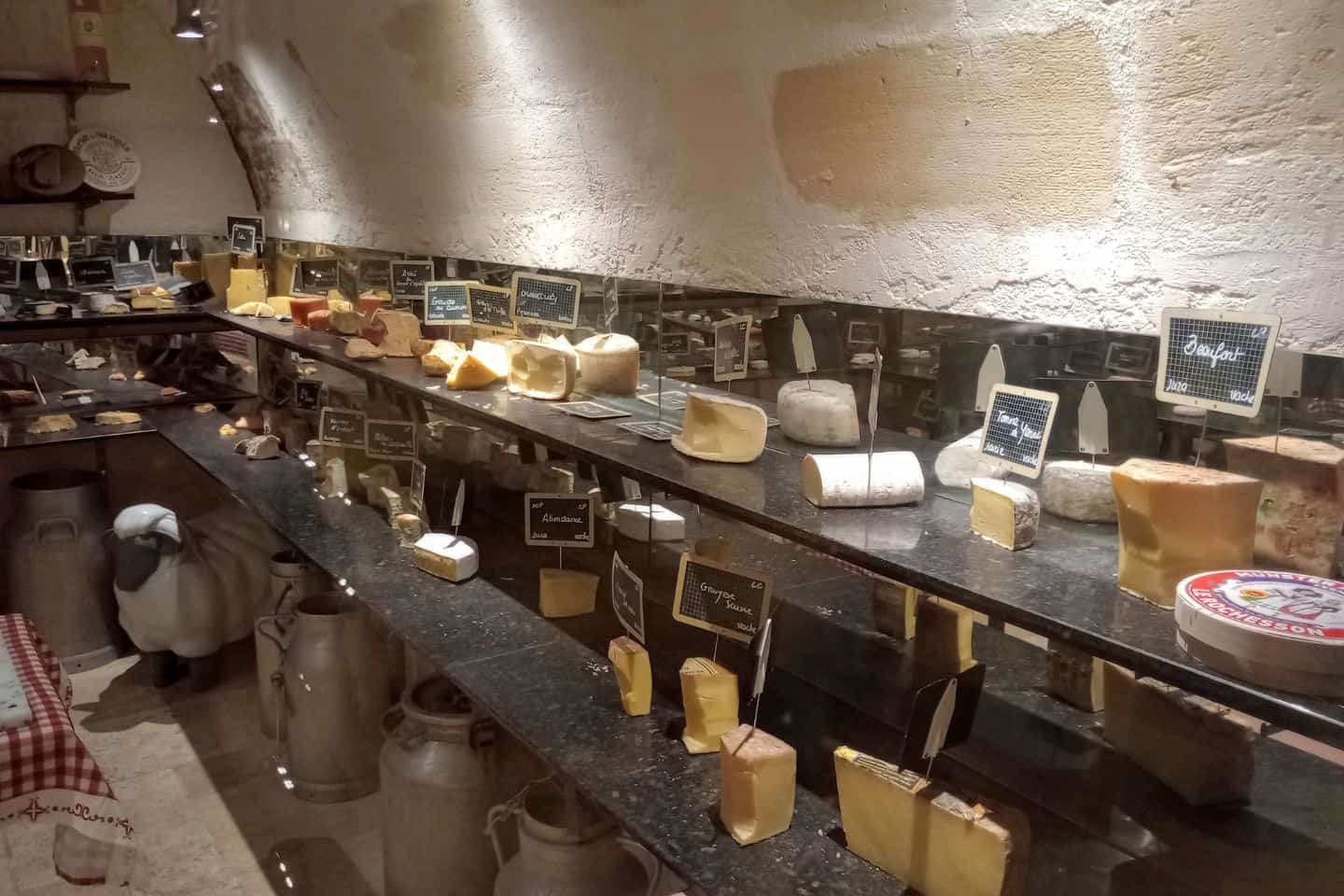 Dozens of cheeses in a cellar