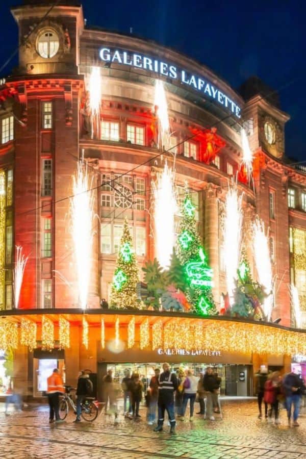 A department store decorated with Christmas lights