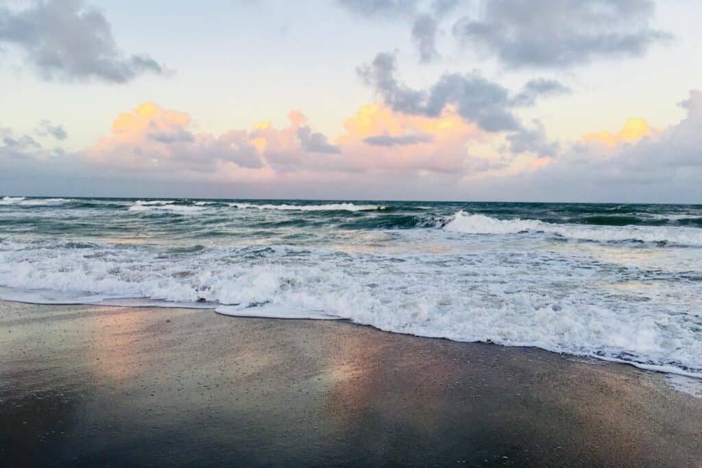 foamy water along the florida coast at sunrise