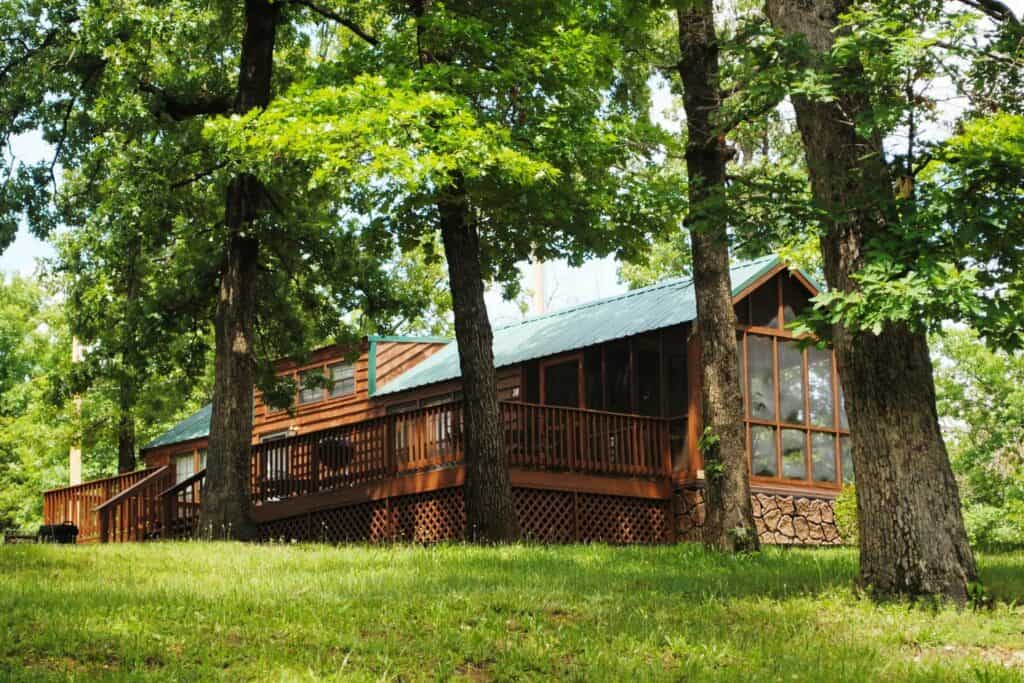 A wood cabin surrounded by trees
