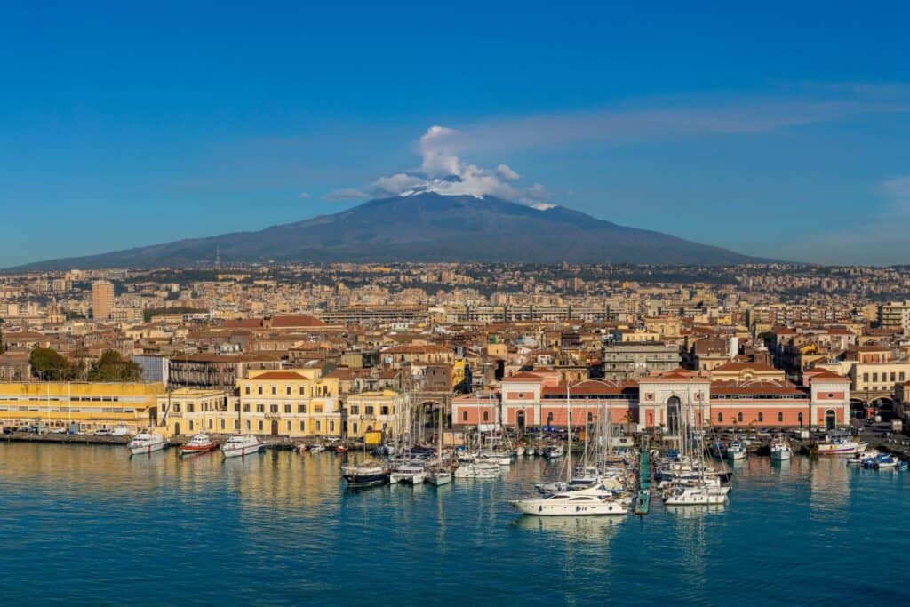 A port city with a mountain in the background