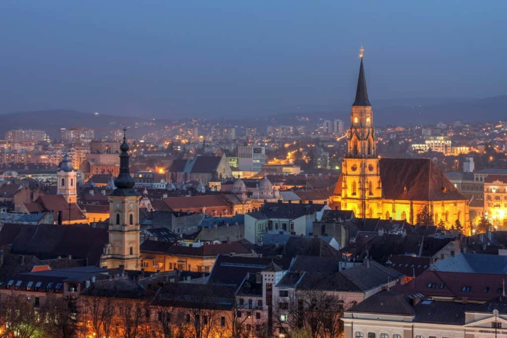 The skyline of a city at dusk