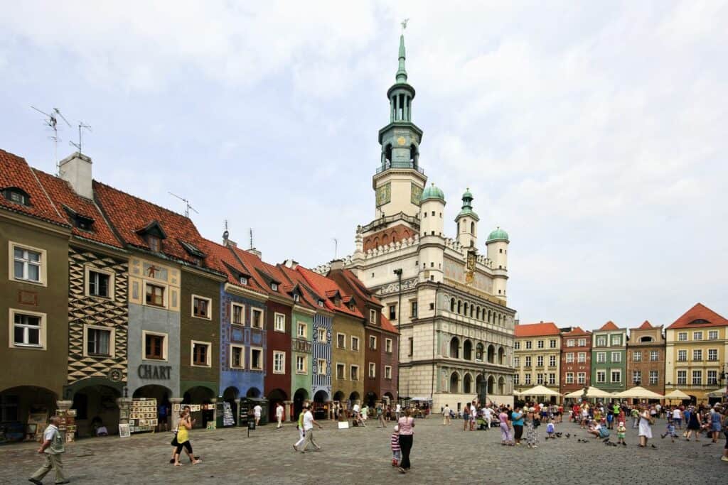 a european city square with colorful buildings