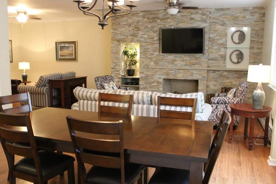 A nicely decorated dining room and living room