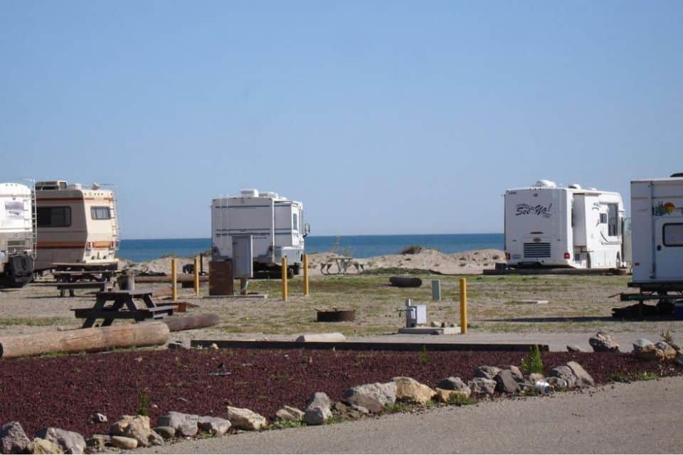 Multiple RVs parked by the beach