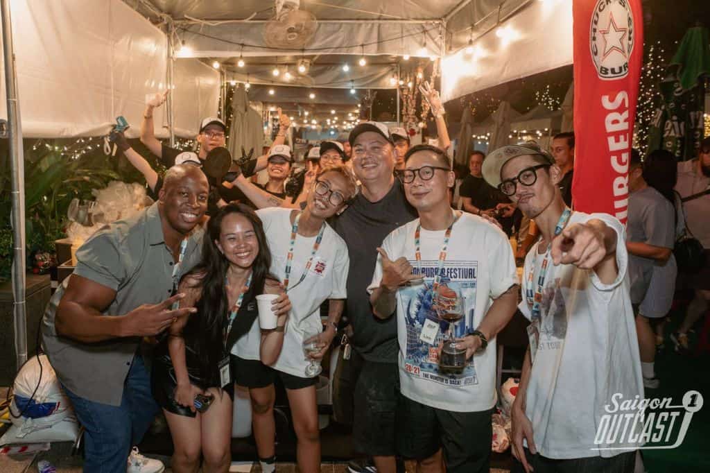 Markeiz posing with friends at an outdoor festival in Ho Chi Minh City
