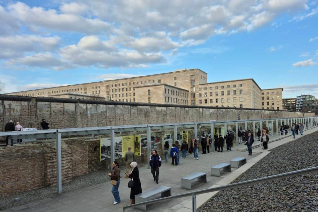 Outdoor exhibit in Berlin with preserved wall remains and historical display panels