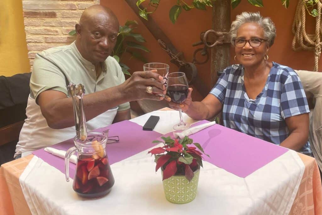 A couple toasting with sangria at a restaurant