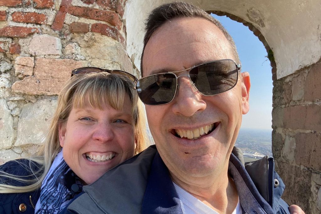A smiling couple taking a selfie in Vicenza, Italy