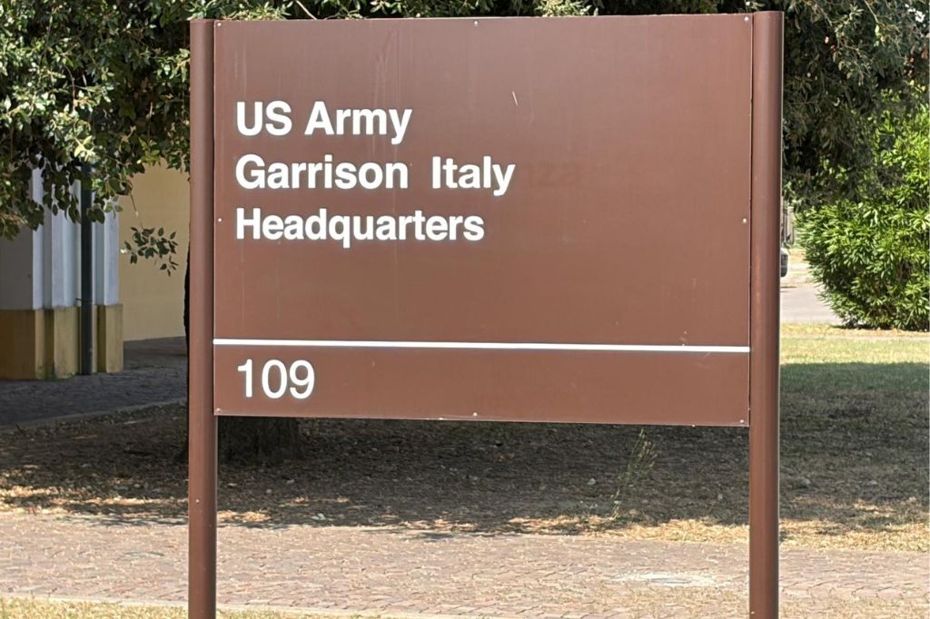 Brown U.S. Army Garrison Italy Headquarters sign outside a building in Vicenza