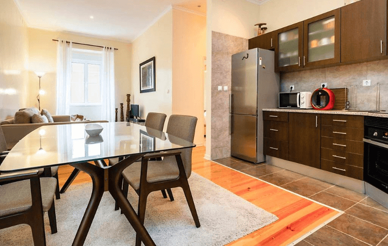 Modern dining room and kitchen in our Airbnb in Lisbon