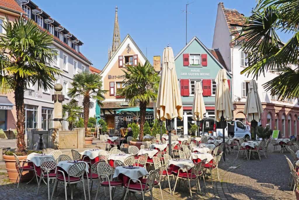 A German town square filled with restaurant tables