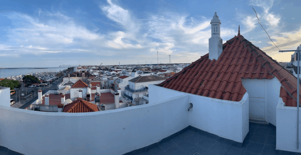 View of rooftop from a white balcony