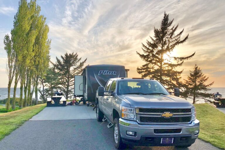 A truck parked in front of an RV