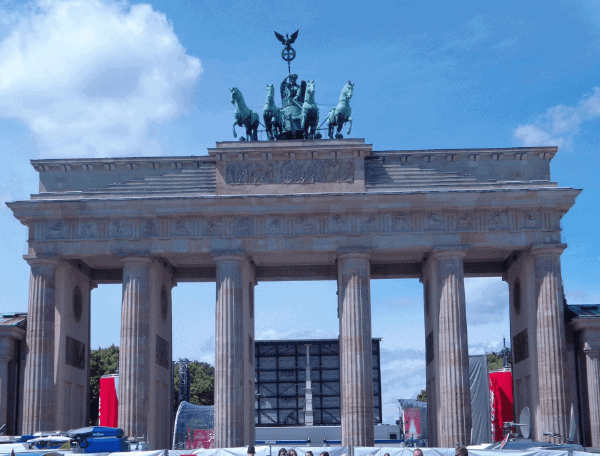 The columns of the Brandenburg Gate with a statue of horses on top