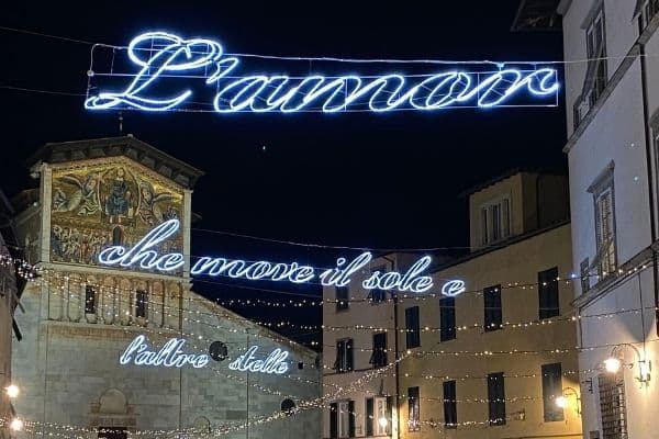 Holiday lights in Lucca with writing in Italian