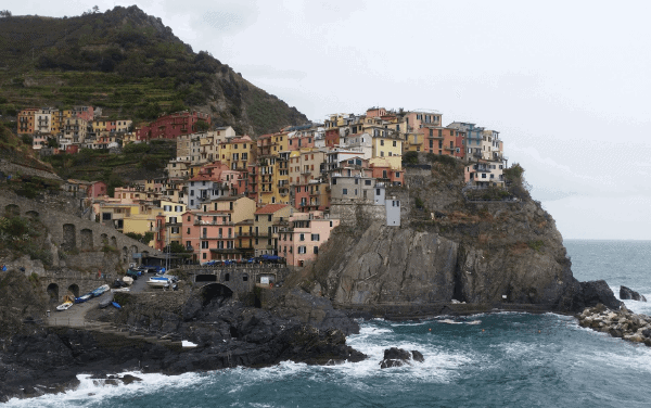 The colorful buildings of Cinque Terre on a cliff at the edge of the sea