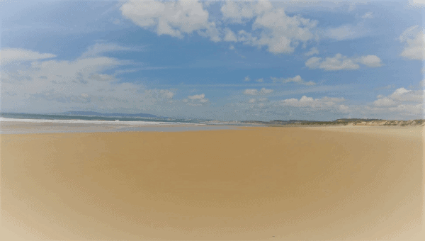 A wide, flat beach in Costa da Caparica, outside Lisbon