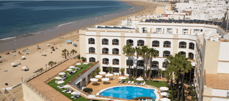 The Hotel Duque de Nájera from above, with a view of the pool and the Rota, Spain beaches.