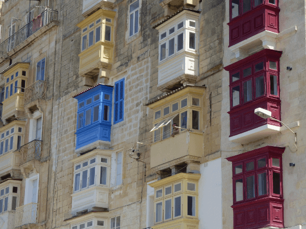 Colorful full-length windows typical of Maltese architecture