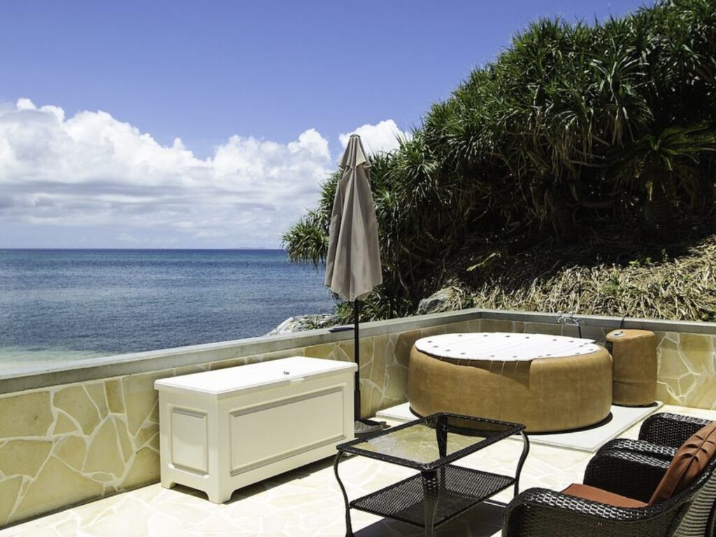 A furnished outdoor patio overlooking the ocean