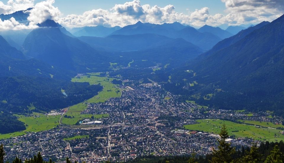 A town in a valley surrounded by mountains