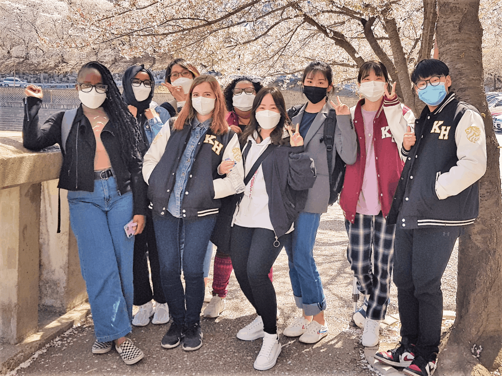 A group of students standing together wearing masks