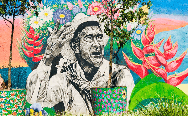 Mural of man and flowers in Medellin, Colombia