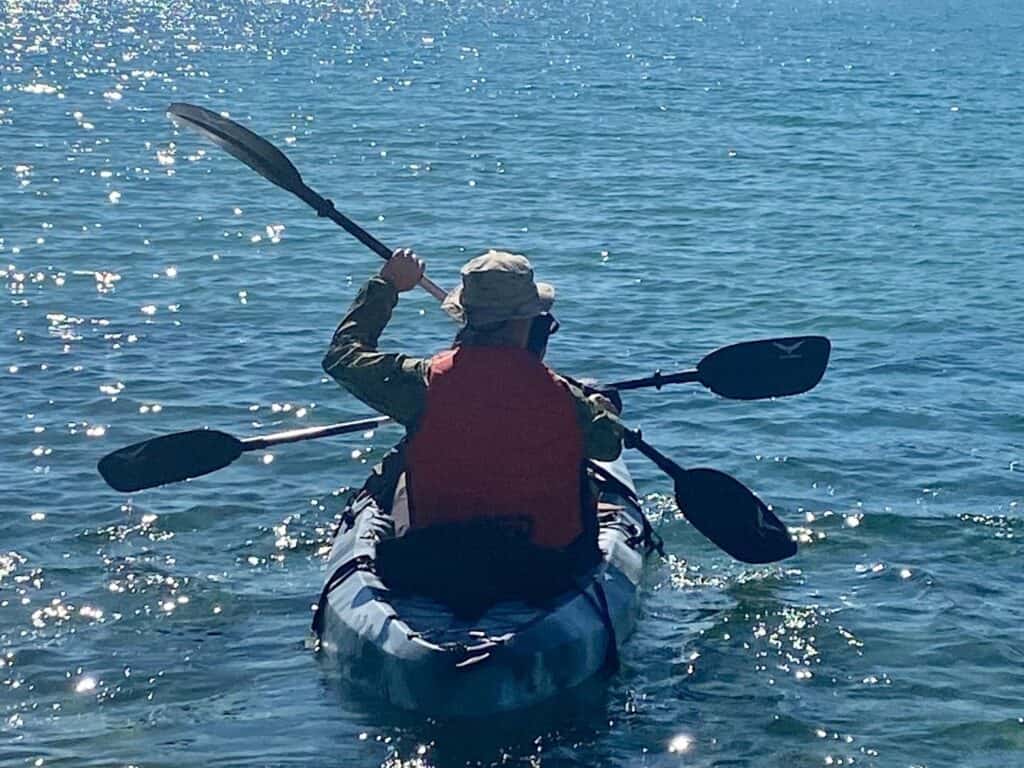 Two people paddling in a kayak