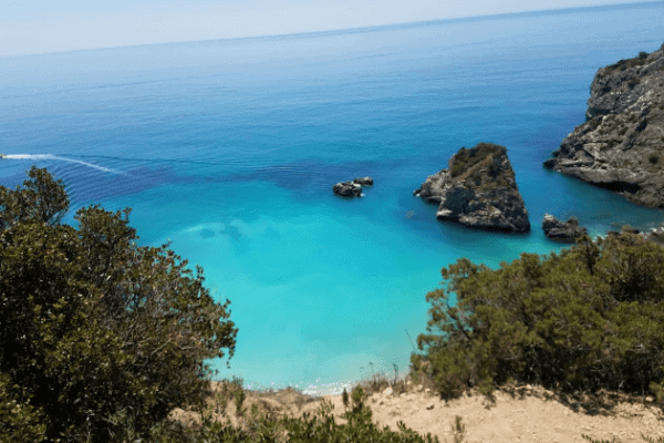 View of the clear blue water at Ribeira do Cavalo in Sesimbre, Portugal