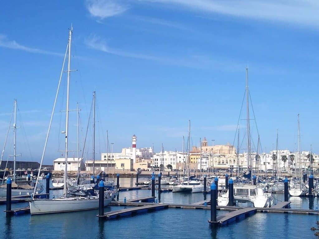 Ships in harbor with the skyline of Rota, Spain in the background