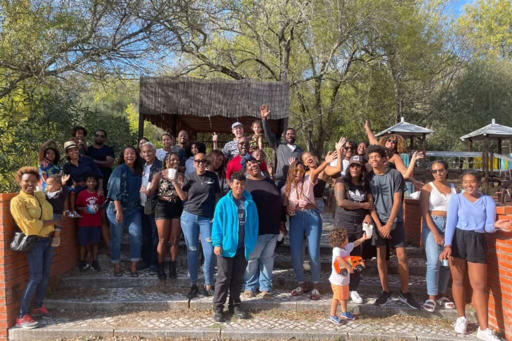 A large group of friends standing in a park