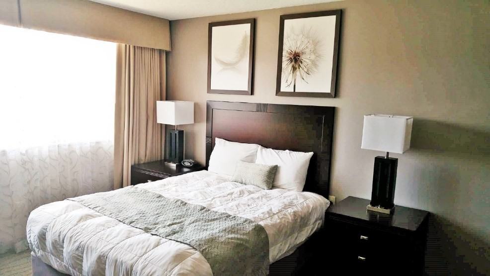 A hotel room with modern decor in military lodging
